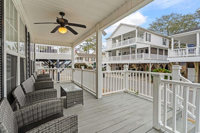 deck with ceiling fan and outdoor lounge area