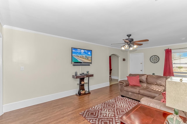 living room with ornamental molding, ceiling fan, and hardwood / wood-style flooring