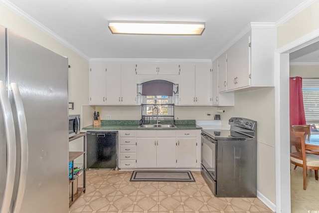 kitchen with black appliances, a healthy amount of sunlight, white cabinets, and sink