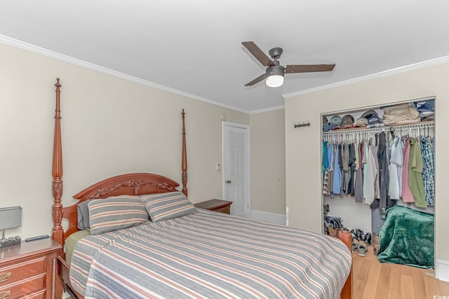 bedroom featuring ornamental molding, a closet, ceiling fan, and light wood-type flooring