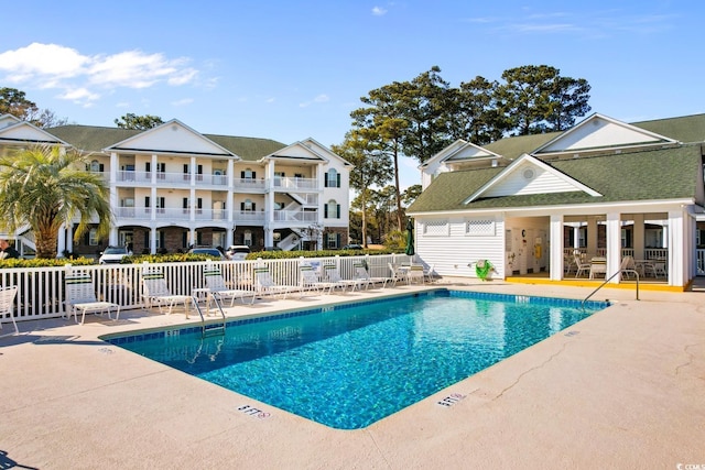 view of swimming pool featuring a patio area