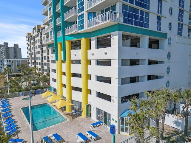 view of property featuring a community pool