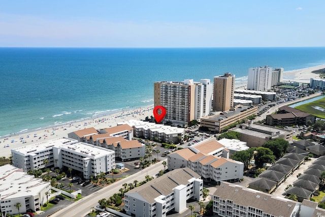 bird's eye view featuring a view of the beach and a water view