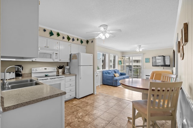 kitchen featuring sink, crown molding, a textured ceiling, white appliances, and white cabinets