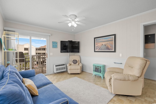 living room featuring crown molding, a textured ceiling, a wall unit AC, ceiling fan, and light parquet flooring