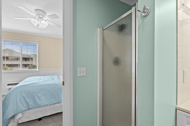 bathroom featuring ornamental molding, ceiling fan, a textured ceiling, and walk in shower