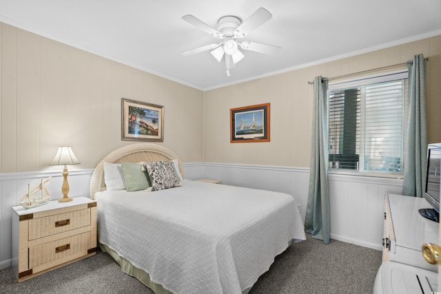 bedroom featuring dark carpet, ornamental molding, and ceiling fan