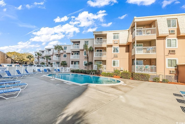 view of swimming pool with a patio