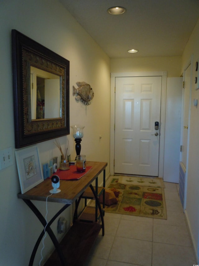 entryway with light tile patterned flooring