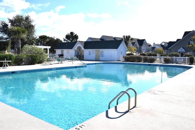 view of swimming pool with a pergola and a patio area