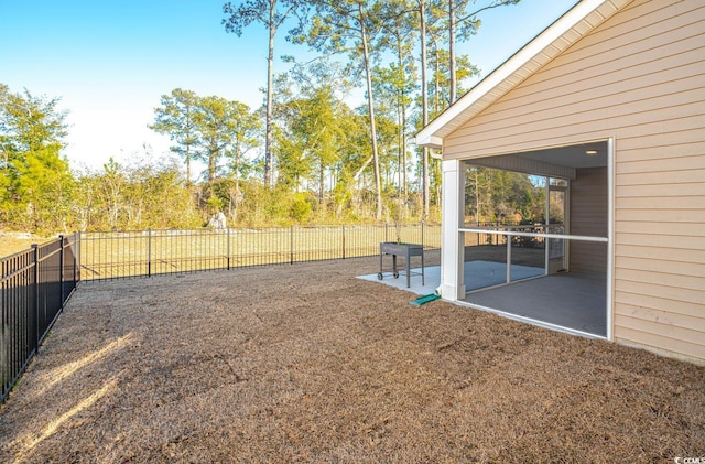 view of yard featuring a patio area and a sunroom