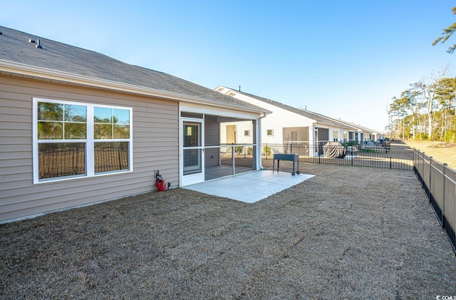 back of house with a patio