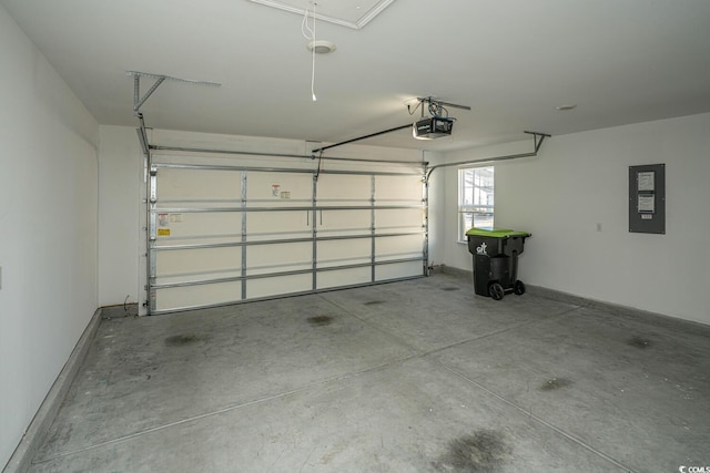 garage featuring electric panel and a garage door opener