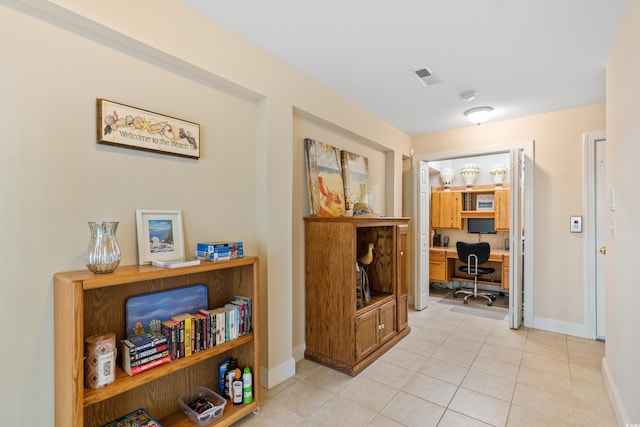 hallway with light tile patterned flooring