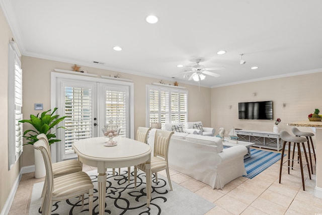 living room featuring ceiling fan, crown molding, and light tile patterned floors