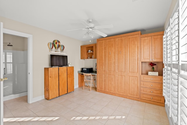 kitchen with ceiling fan and light tile patterned flooring