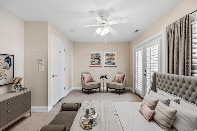 bedroom featuring access to outside, light colored carpet, and ceiling fan