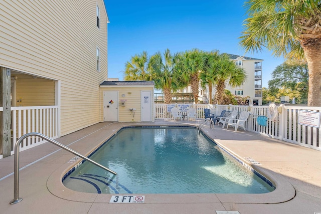 view of pool featuring a patio