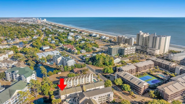 aerial view with a water view and a view of the beach