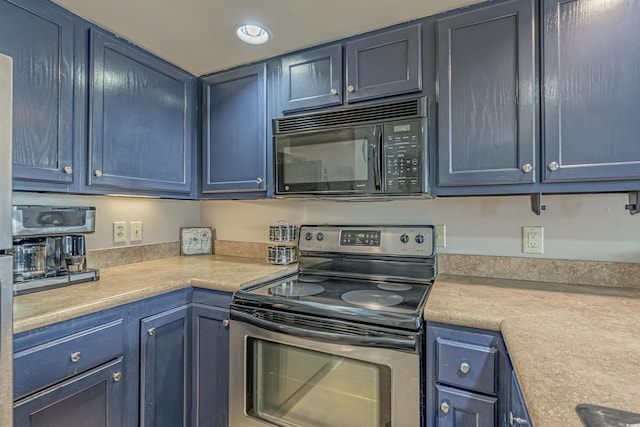 kitchen featuring black microwave, stainless steel electric range, blue cabinets, light countertops, and recessed lighting