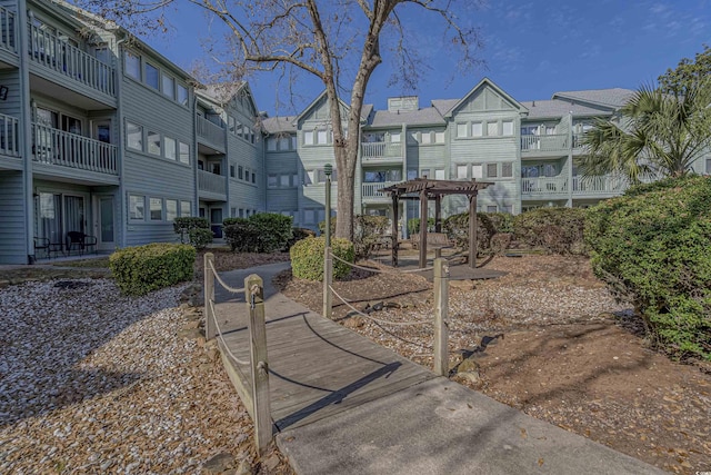 surrounding community with a pergola