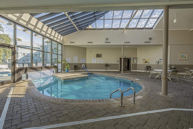 indoor community pool with a patio area and a lanai