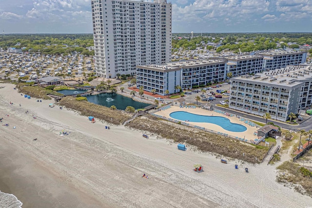 bird's eye view of a pool and a nearby body of water