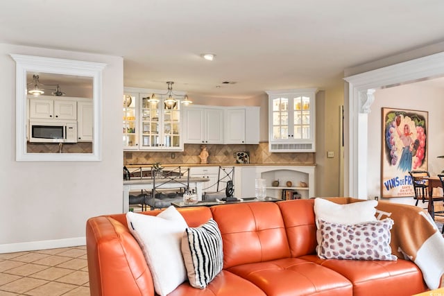 living room with light tile patterned flooring