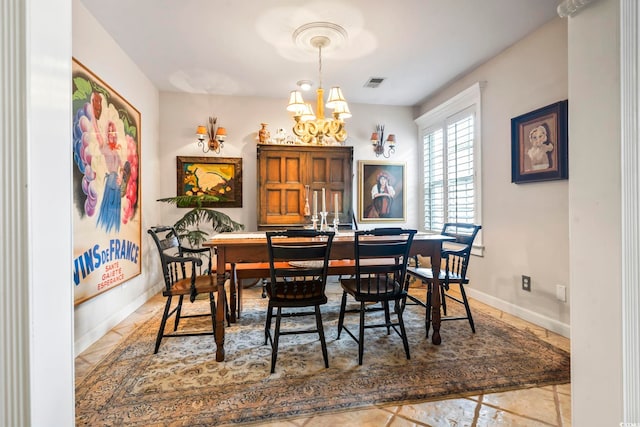 dining room featuring a chandelier