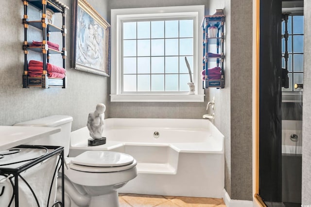 bathroom with toilet, independent shower and bath, and tile patterned flooring