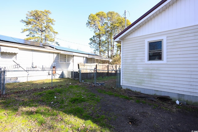 view of property exterior featuring solar panels