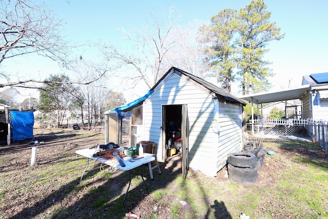 back of property with a storage shed