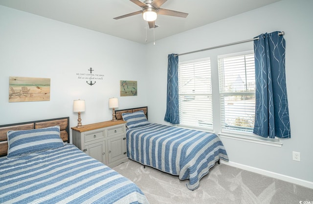 bedroom featuring light carpet and ceiling fan