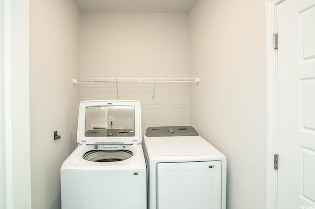 laundry area with washer and clothes dryer