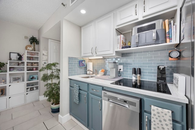 kitchen featuring dishwasher, backsplash, white cabinets, blue cabinets, and black electric cooktop