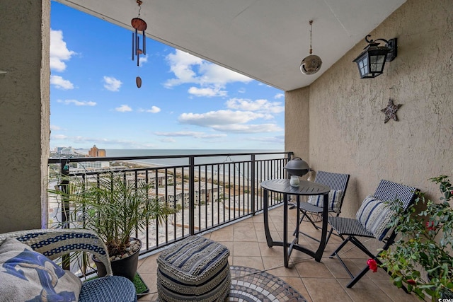 balcony with a view of the beach and a water view