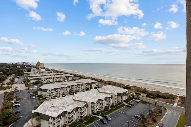 aerial view featuring a view of the beach and a water view