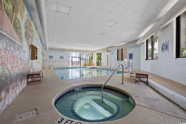 view of swimming pool with an indoor in ground hot tub