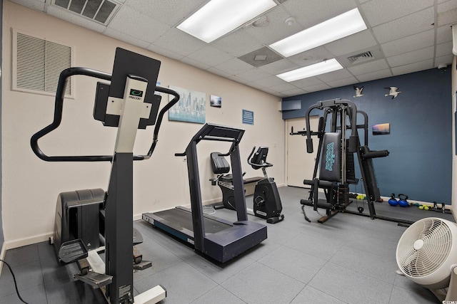 workout room featuring a drop ceiling