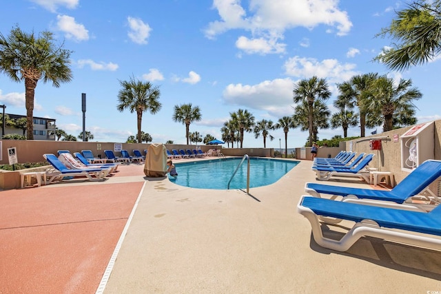 view of swimming pool featuring a patio