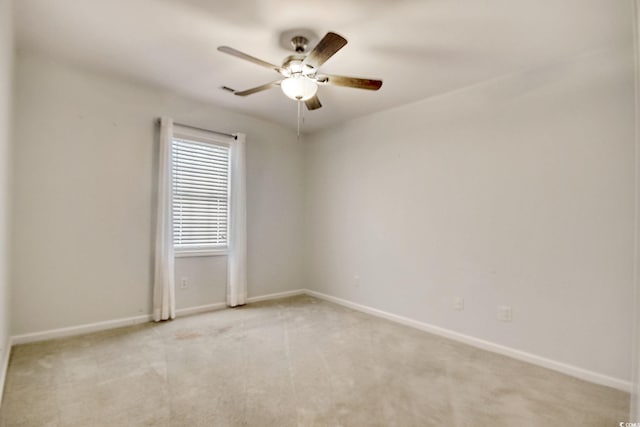 unfurnished room featuring light carpet and ceiling fan