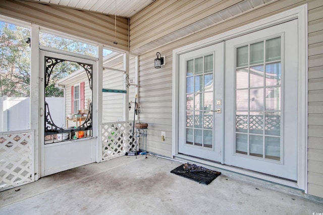 unfurnished sunroom with vaulted ceiling