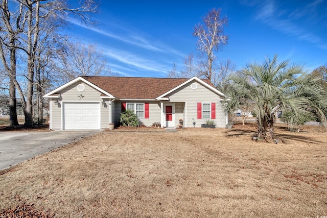 ranch-style home featuring a garage and a front yard