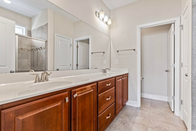 bathroom featuring vanity and a shower with shower door