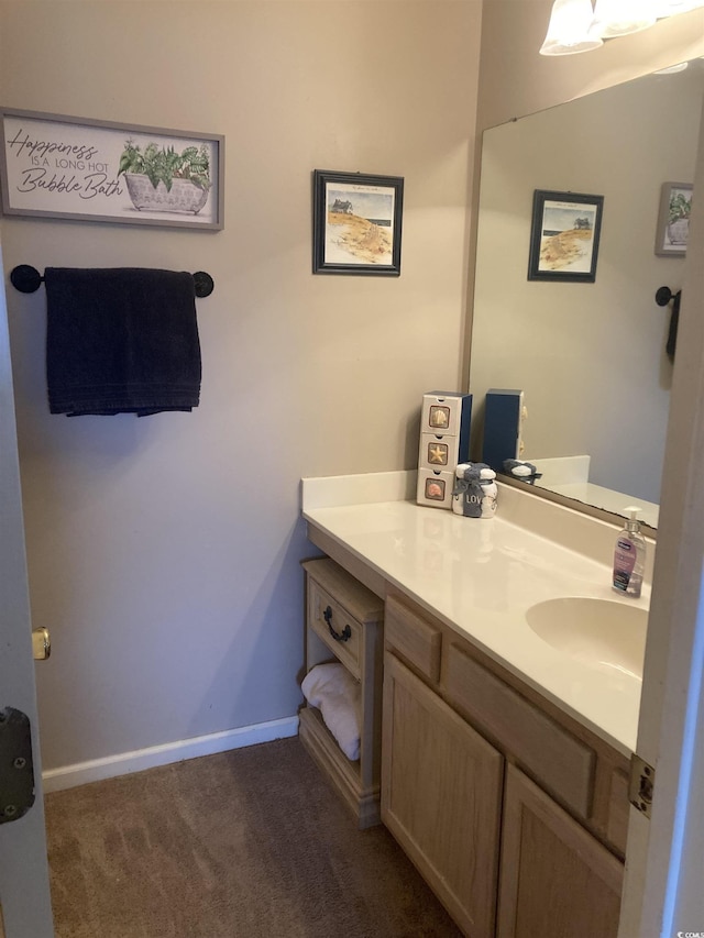 bathroom with baseboards and vanity