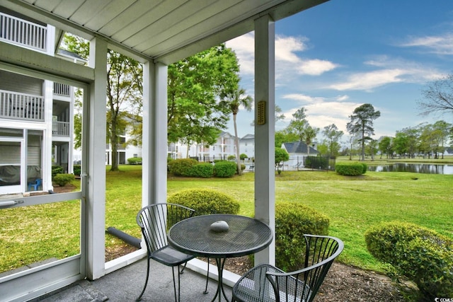 sunroom with a water view