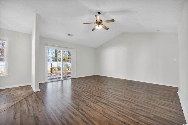 unfurnished living room featuring lofted ceiling, ceiling fan, and dark hardwood / wood-style flooring