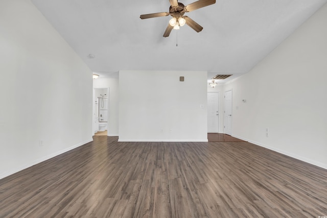 unfurnished living room featuring ceiling fan and dark wood-type flooring