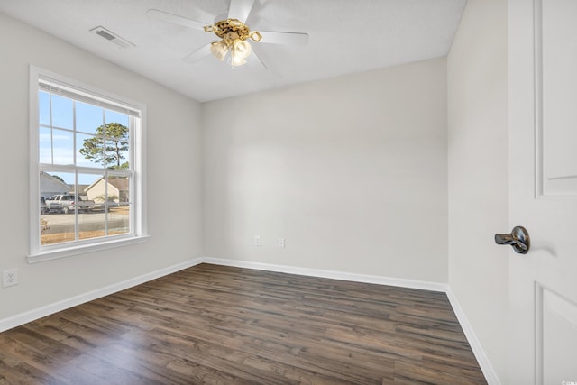 unfurnished room featuring ceiling fan and dark hardwood / wood-style flooring