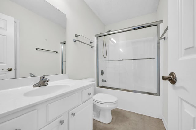 full bathroom featuring bath / shower combo with glass door, a textured ceiling, toilet, and vanity